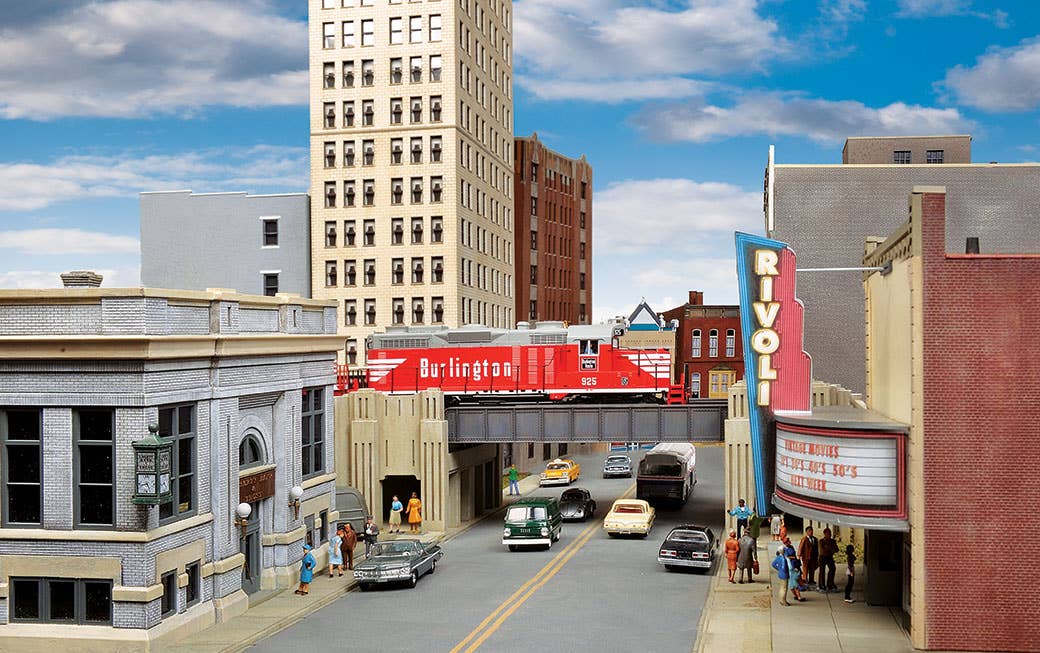 1960s commercial district scene with a nice vehicle mix, modeled in HO Scale