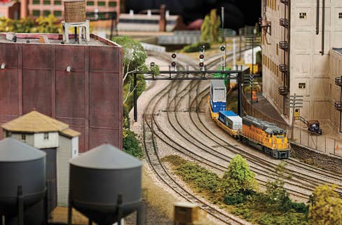 Build A Club Product Image - Downtown scene with HO Scale buildings, model train and cars